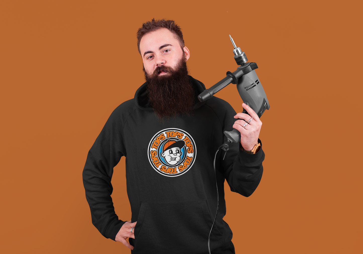 a man with a beard holding a drill