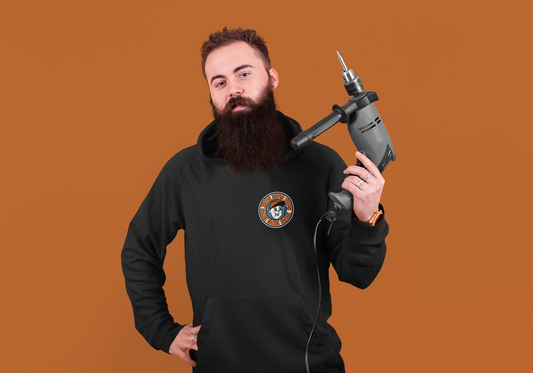 a man with a beard holding a drill